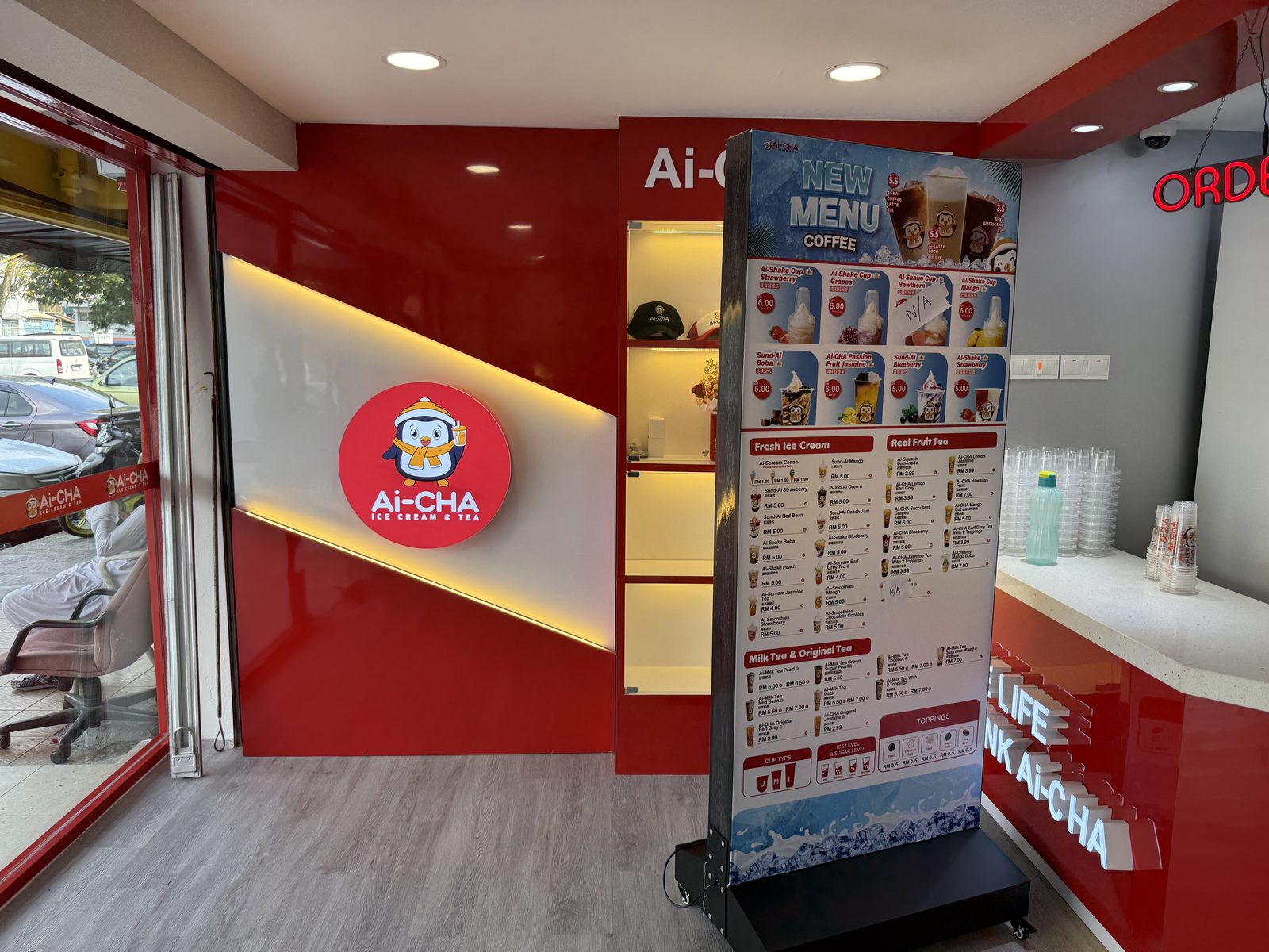 Ai-CHA branded wall and menu standee