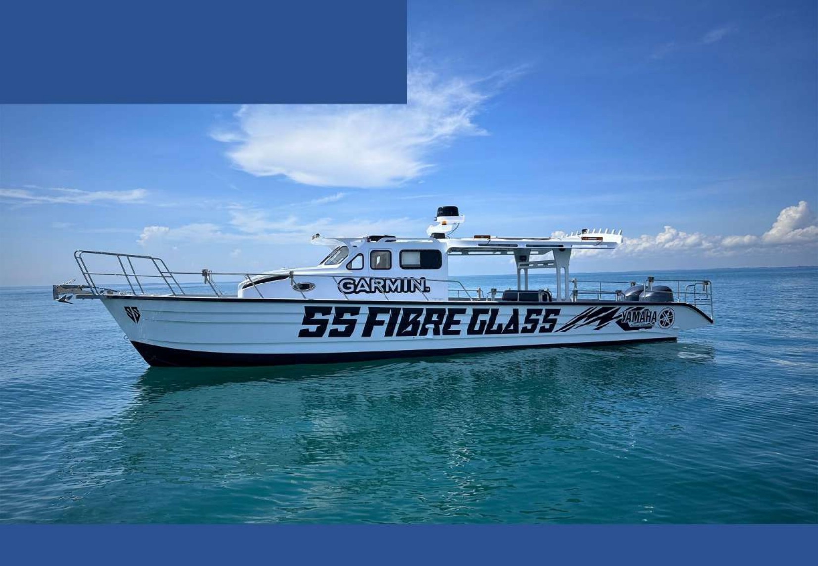 SS FIBRE GLASS branded fibreglass boat at sea
