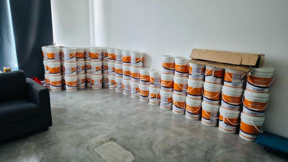 SuperHeal waterproofing product pails stocked at the office