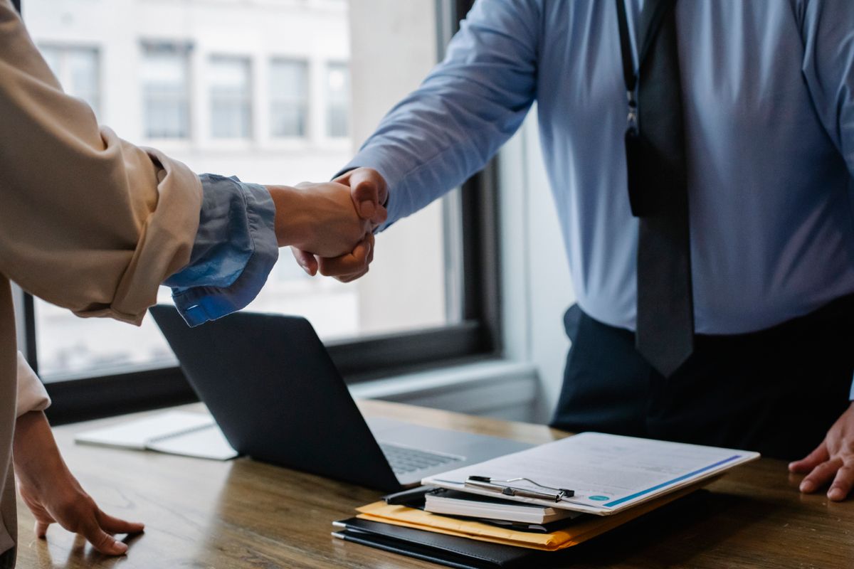 Advisers completing a trademark registration application over documents