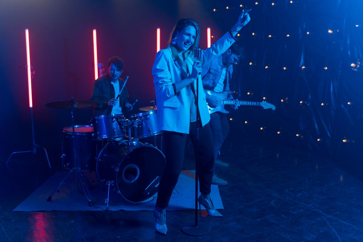 A live band performing under neon lights, the kind of night entertainment that needs a DBKL entertainment licence in Kuala Lumpur