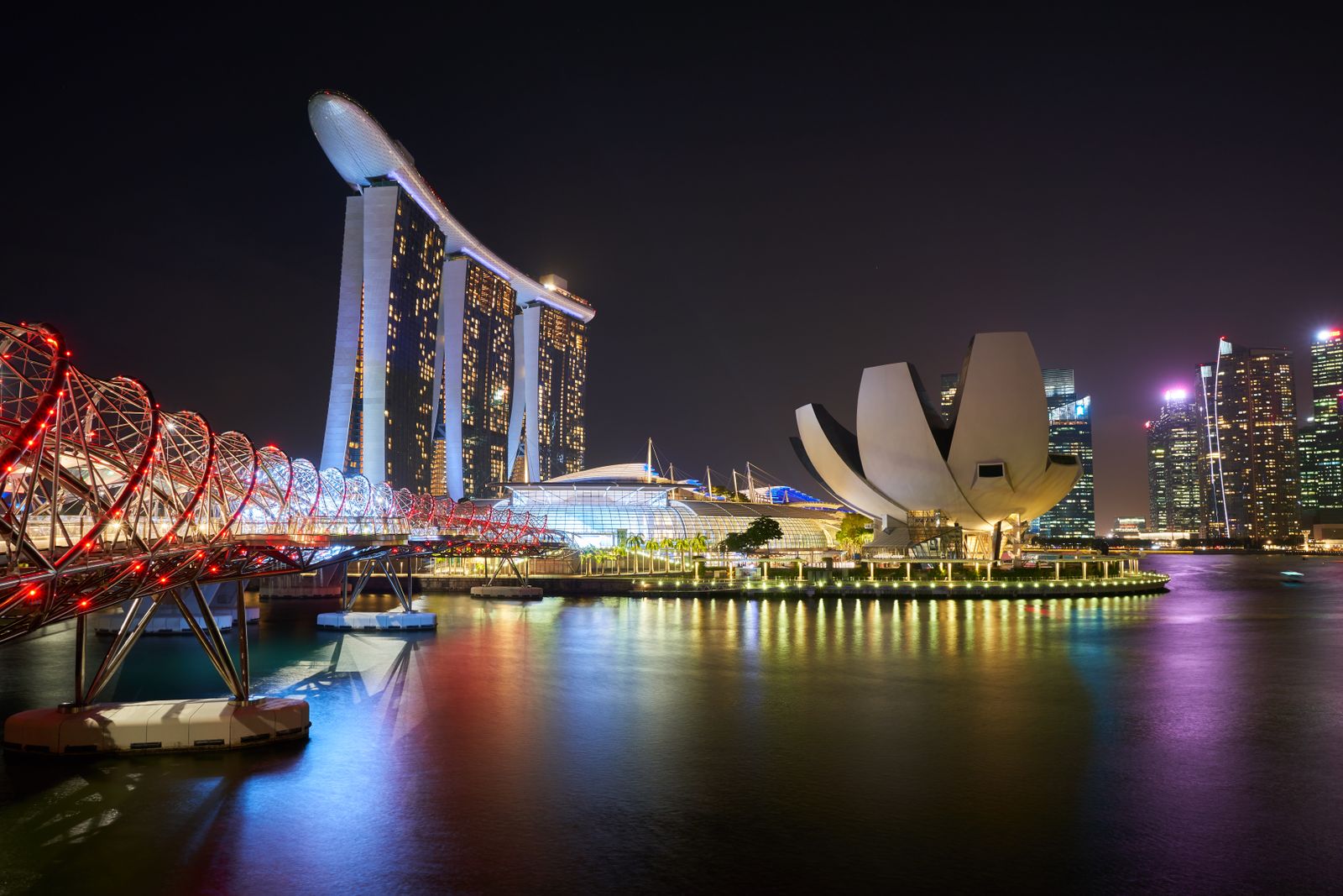 Marina Bay Sands, the ArtScience Museum and the Helix Bridge at night in Singapore