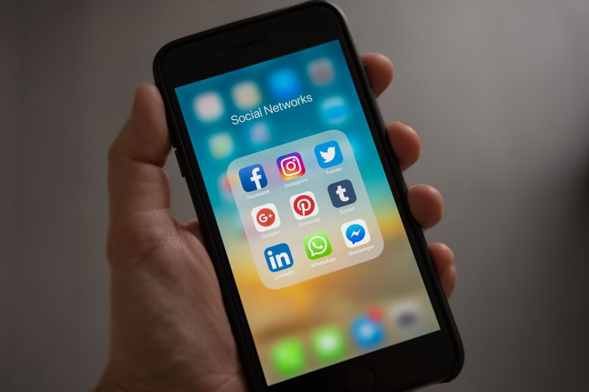 Smartphone screen showing social media and messaging applications used for social commerce
